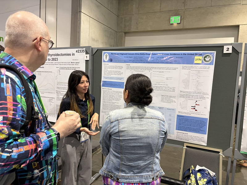 Michelle Nagata discussing poster
